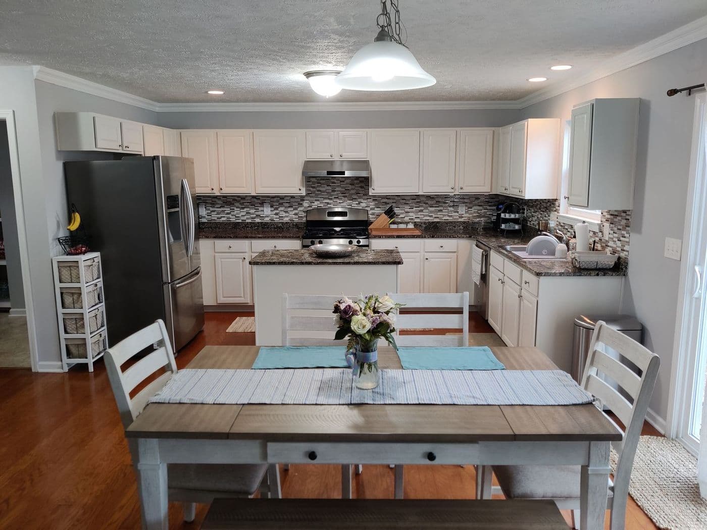 Refinished white kitchen cabinets in Northeast Ohio by Cavelli Painting