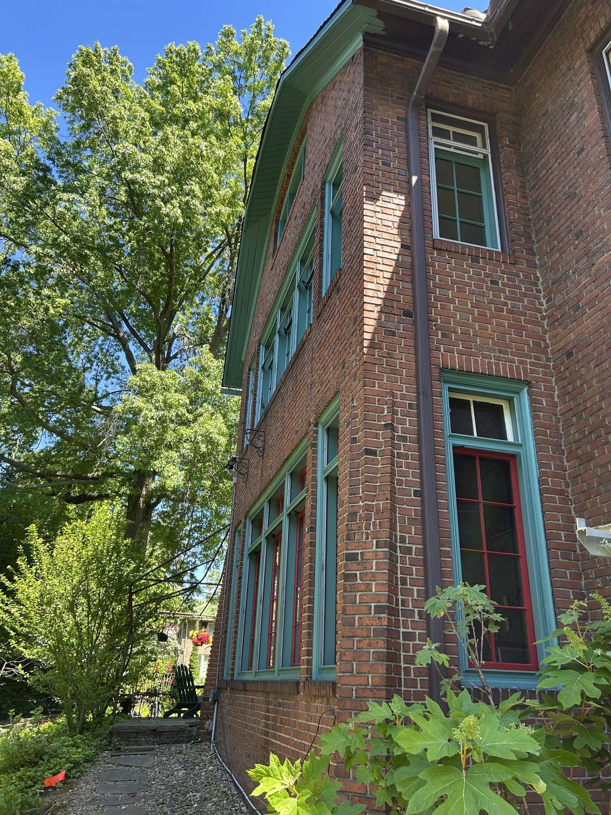 Restored and repainted period window trim in teal and red, Cleveland Heights